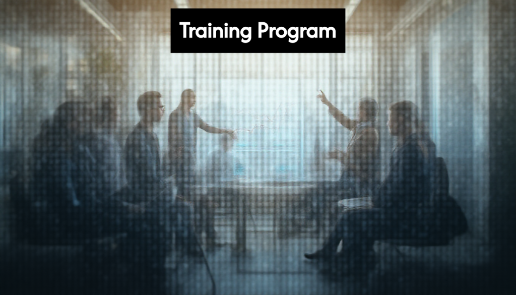 Professionals analyzing training metrics on a screen.